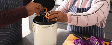 senior biracial couple wearing aprons composting f 2025 04 04 11 20 04 utc